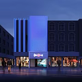 Nighttime Commercial Storefront Design With Blue Illuminated Facade Bingo Sign And Pedestrians