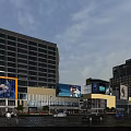Modern High Rise Residential Building With Glass Facade In Commercial Area And Street