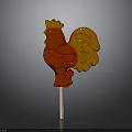 Red And Gold Rooster Shaped Lollipop On Wooden Stick With Shiny Surface