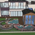 Sunlit Garden With Fire Pit Pond Wooden Deck Rocks Lush Plants And Trees