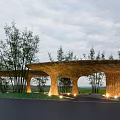 Outdoor Pergola With Curved Structure Natural Material Bamboo Trees And Soft Lighting