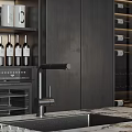 Dark Modern Kitchen Interior With Marble Island Wine Rack Dark Cabinets And Bar Stools