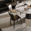 Modern Round Marble Dining Table Set With Six Black And White Chairs And Flower Vase
