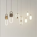 Modern Pendant Lights With Various Shapes Metal Frames And White Illuminated Shades On White Wall