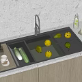 Modern Kitchen Faucet Over Stainless Steel Sink With Fresh Lemons And Cucumbers