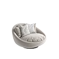 Single Sofa with Round Design Light Colored Soft Fabric and Decorative Striped Dotted Cushions