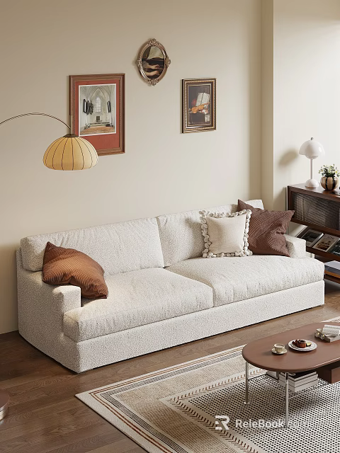 Light Colored Sofa With Brown Decorative Pillows And Coffee Table Near Bookshelf And Wall Art 3d model 