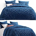 Double Bed with Blue Diamond Pattern Quilt and Soft Decorative Pillows