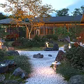 Illuminated Japanese Courtyard Garden With Pebble Path Stone Lanterns Autumn Trees And Green Plants