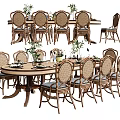 Wooden Dining Table Set With Cane Back Chairs And Green Plant Centerpieces