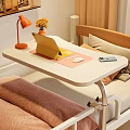 Mobile Functional Desk with Tablet Stand Mouse Phone Orange Lamp and Flower Vase Beside Bed