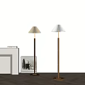 Modern Minimalist Floor Lamps With Light Colored Shades And Dark Wooden Bases In Living Room