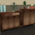 Vintage Wooden Cabinets With Blue Bottles Fan Potted Plant And Mirror