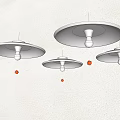 Three Modern Wall Lamps On Wall With Round Shades And Visible Light Bulbs