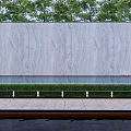 Outdoor Grey Stone Feature Wall With Lush Greenery Water Feature And Illuminated Lights