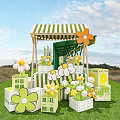 Outdoor Stage With Green White Striped Awning Orange White Flowers Wooden Crates And Grassland Background