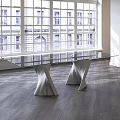 Plisset Coffee Table with Glass Top and Unique Artistic Leg Design