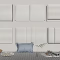 White Upholstered Headboards Arranged On Wall With Bed Pillows Magazine And Plant Decor