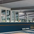 Modern Basketball Court Interior With Pendant Lights Blue Walls White Floor Lines and Hoops