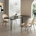 Modern Minimalist Dining Table Set With Black Table And White Chairs In Bright Room