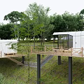 Modern Guesthouse Building With Elevated Wooden Terrace And Lush Green Trees Surrounding