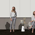 Women Using VR Headset in Modern Space Standing and Sitting with Trophy Table