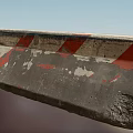 Concrete Road Barrier With Red White Stripes And Chipped Paint For Traffic Safety