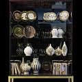 Stylish Display Cabinet With Glass Doors Porcelain Vases Plates And Gold Legs