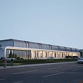 Modern Industrial Factory Building Facade With Glass Windows Evening Lights And Landscaped Surroundings