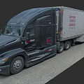Large Black Commercial Truck With Construction Hauling Trailer On Road