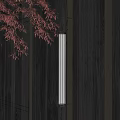 Elegant Cylindrical Wall Lamp On Dark Wooden Wall With Red Maple Leaves