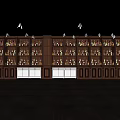 Illuminated Modern Wine Cabinet Lined With Various Wine Bottles In Dark Room