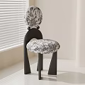 Modern Dining Chair With Black And White Floral Pattern And Curved Dark Frame