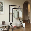Black Metal Foldable Clothes Rack Holding Multi colored Clothes and Storage Basket