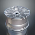 Silver Alloy Wheel Rim With Modern Spoke Design And Shiny Finish Automotive Accessory