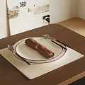 Stylish Dinnerware Set with Plate Napkin Fork Spoon on Woven Placemat Wooden Table