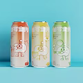 Three Colorful Canned Drinks With Cartoon Characters And Various Flavors