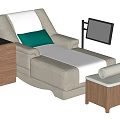 Gray Recliner with White and Green Cushions Beside Wooden Bedside Table and Ottoman
