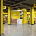 Supermarket Department Store Interior with Yellow Pillars Imported Snacks Candy Pastry Areas and Product Shelves