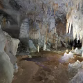 Underground Cave Scenery With Stalactites Stalagmites Natural Rock Formations Dripping Water And Rocky Walls