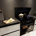 Modern Kitchen With Black Stove Range Hood Toaster And Countertop Appliances