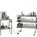 Wheeled Metal Trolleys With Wine Bottles Glassware And Decorative Items