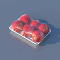 Fresh Ripe Red Apples Neatly Arranged in Clear Plastic Tray Packaging