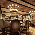 Elegant Restaurant Corridor With Wooden Walls Geometric Patterned Surfaces Green Plant Decor And Patterned Flooring