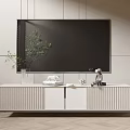 White Ribbed TV Stand With Large TV Green Plant And Decorative Figurines