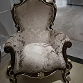 Luxurious European Style Single Sofa With Carved Accents Dark Wood Frame And Patterned Fabric Upholstery