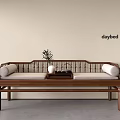 Traditional Chinese Wooden Daybed With Light Colored Cushions Small Table Vase And Tea Set