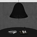 Black Chandelier With Gold Accents Crystal Details Above Black Table With Books Bottle Decor