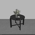 Minimalist Black Round Dining Table With Greenery Vase And White Cup Saucer