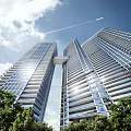 Tall Modern Office Buildings With Glass Curtain Walls Connecting Bridge Green Trees And Blue Sky
